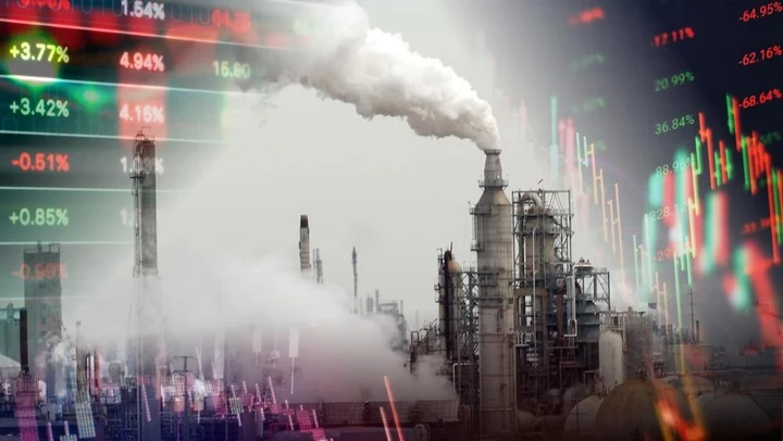 Industrial smokestacks overlaid with financial charts, the official image for the Brookings manufacturing event.