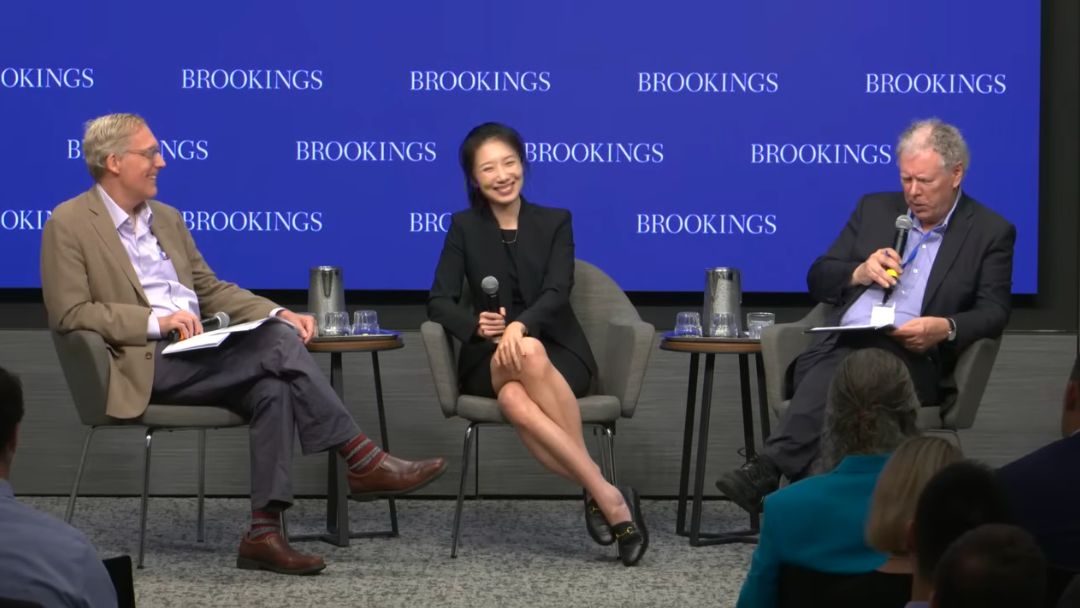 Chuchu Chen smiling with fellow panelists at the Brookings manufacturing forum, from the official July 9, 2026 recording.