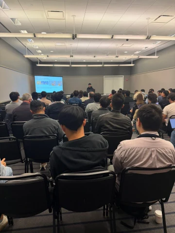 A talk and audience at the Full-Shift Robot Co-Workers workshop.